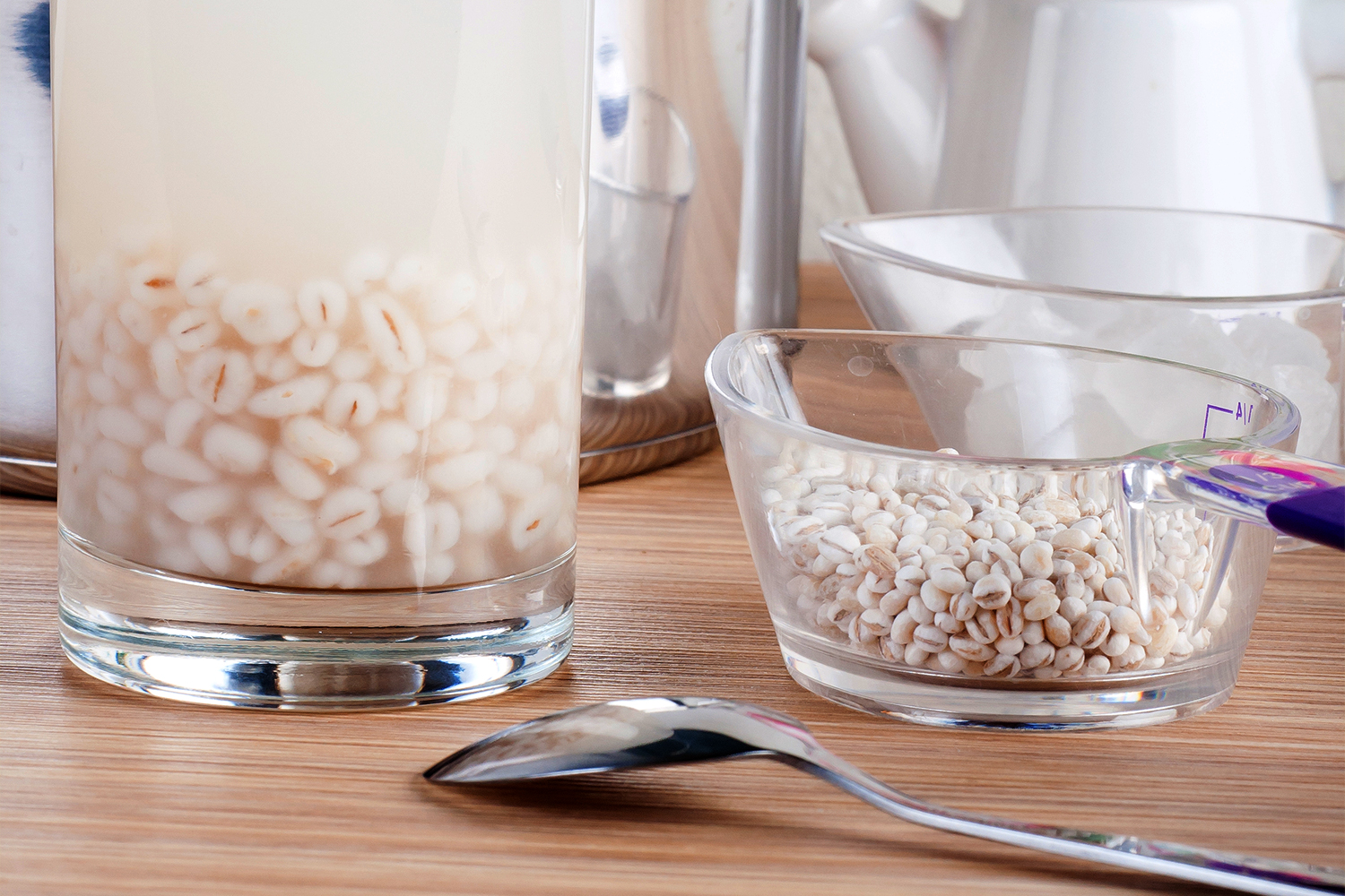 A glass of barley soaking in hot water