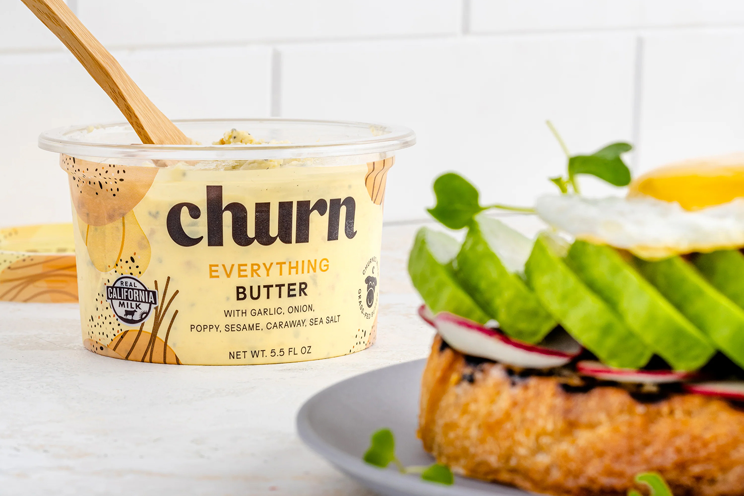 a tub of butter and a delicious toast