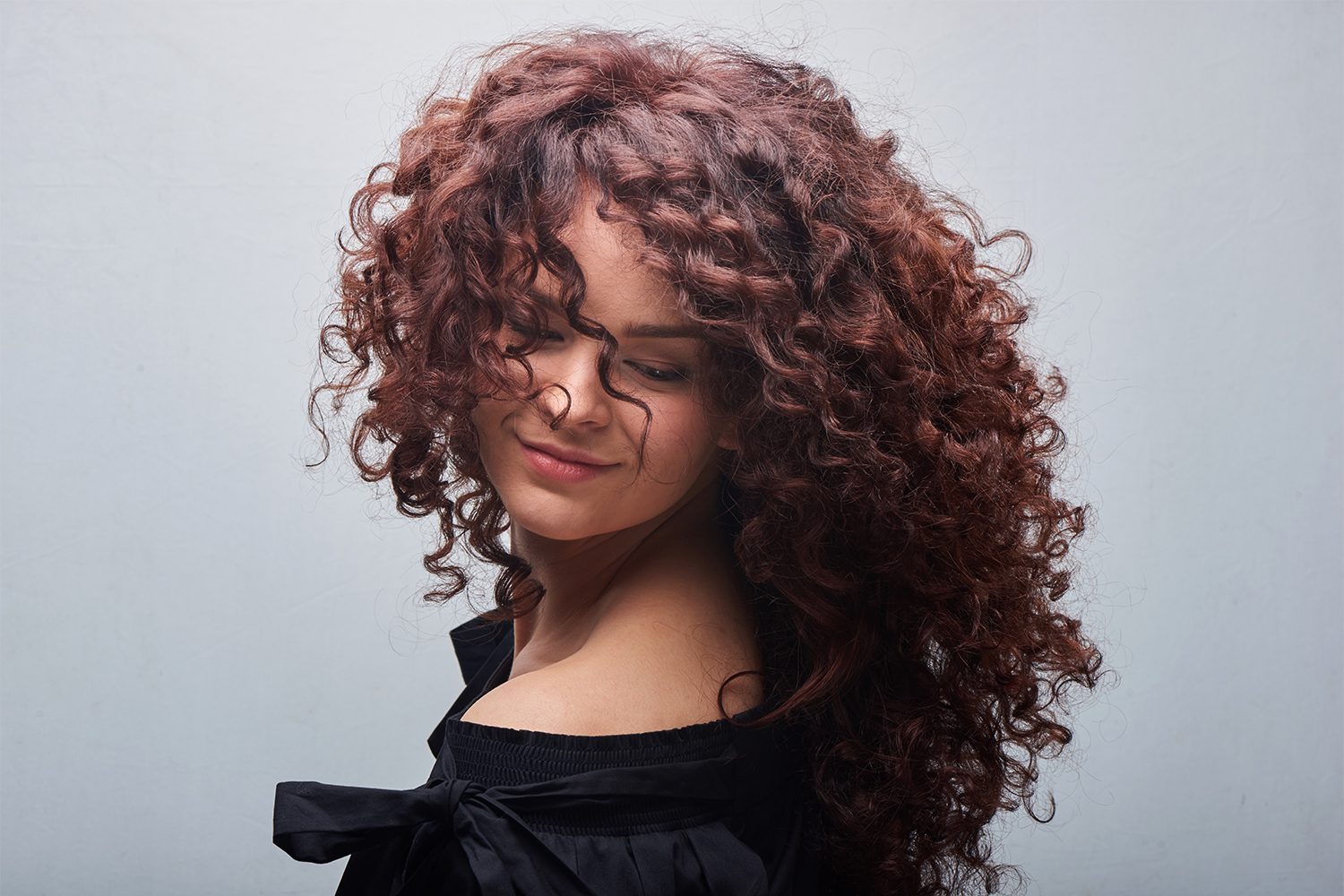 a woman with luxurious curly hair