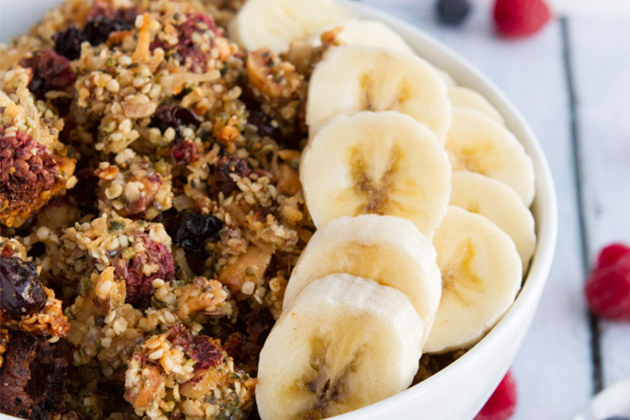 a bowl of granola made from nuts, seeds, and berries