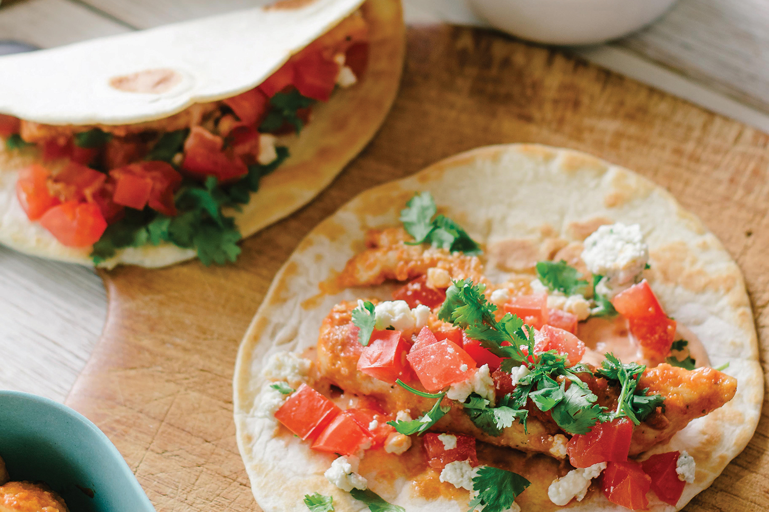 Buffalo Chicken Tacos prepared and ready to eat on a cutting board