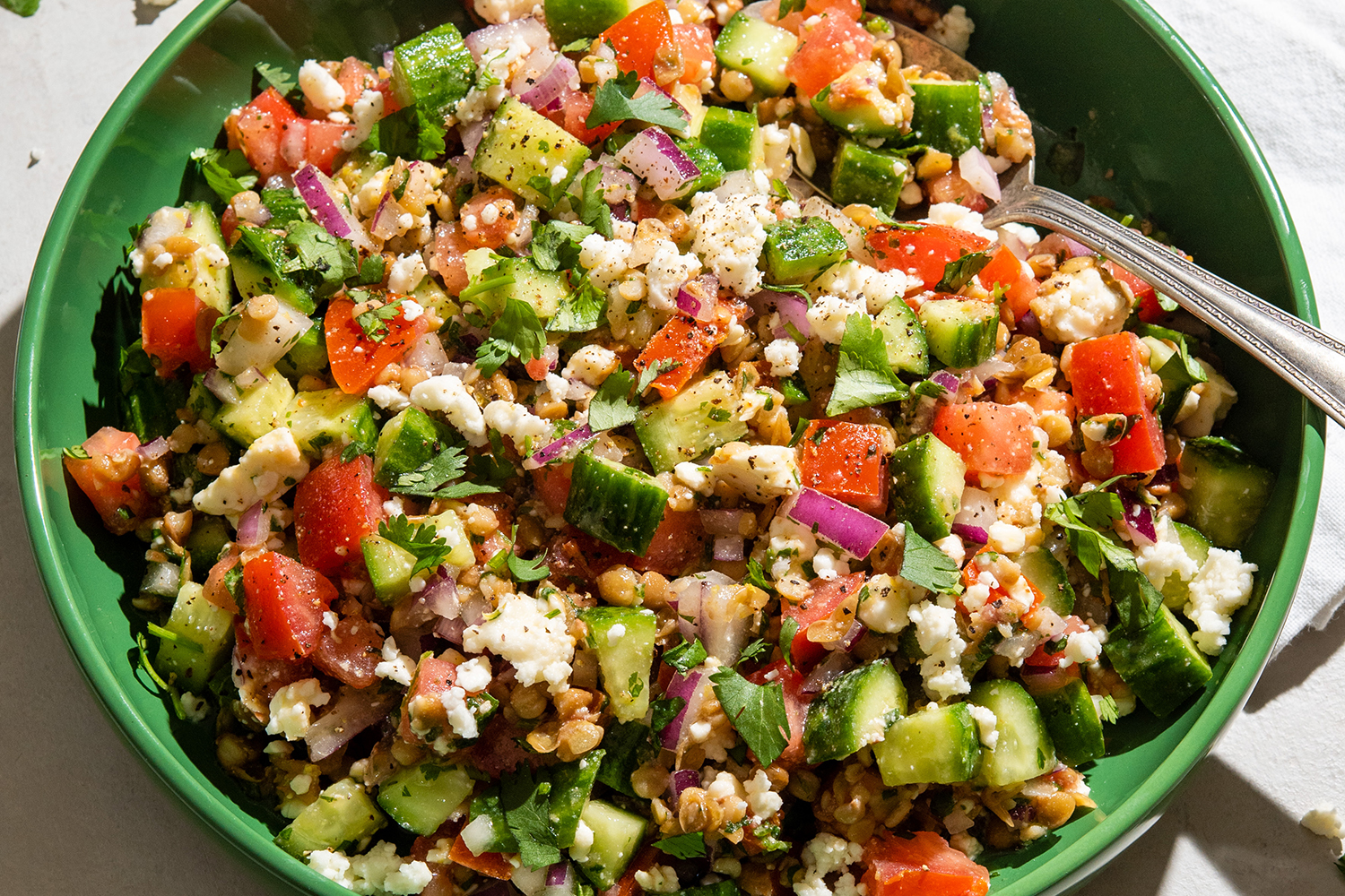 a bowl of lentils and chopped vegetables