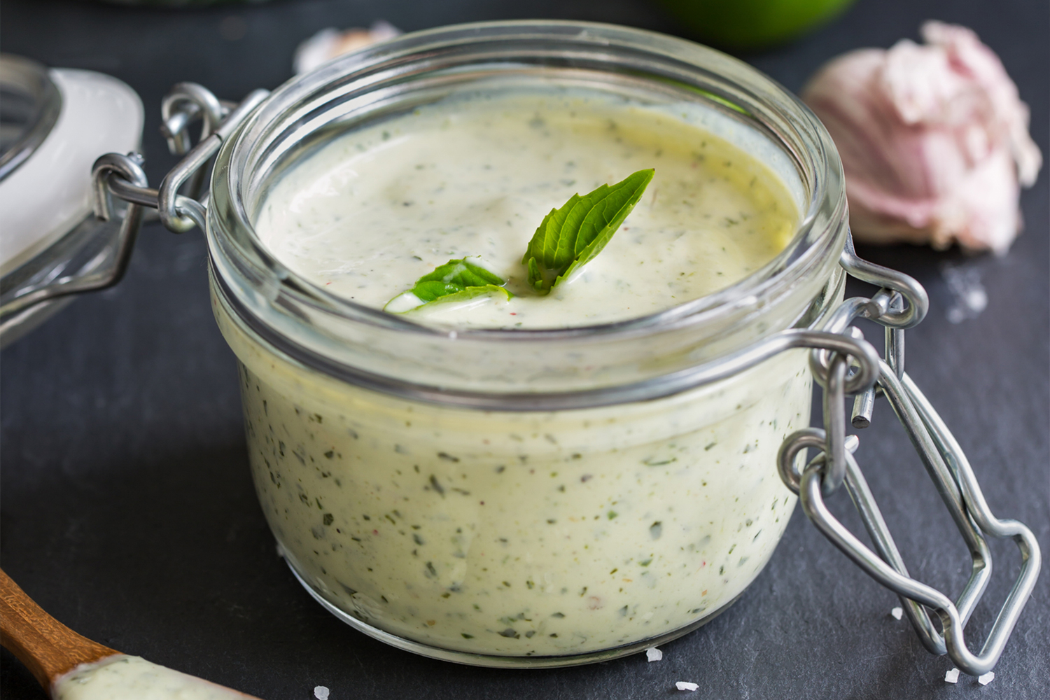 Tofu Basil Dressing in a glass flip to jar.