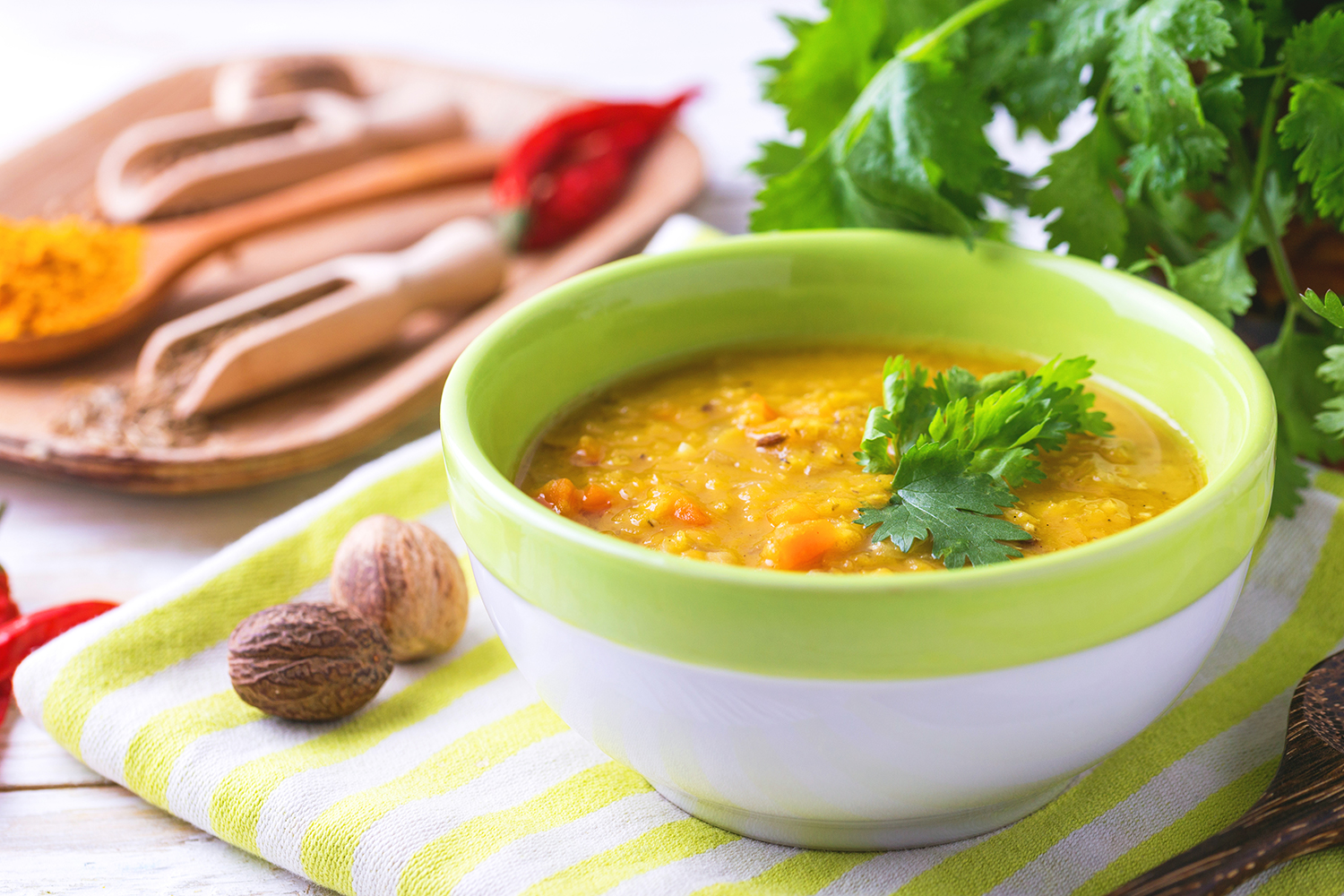 A steaming bowl of red lentil Dal Masoor