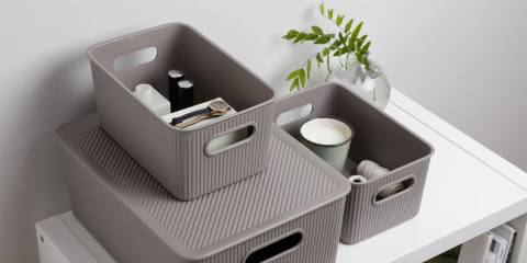 taupe baskets stacked on top of each other