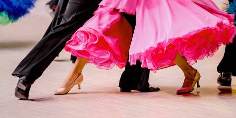 an older couple ballroom dancing