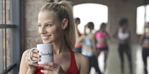 A woman drinking tea in the yoga studio