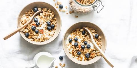 bowls of nuts, seeds, and blueberries