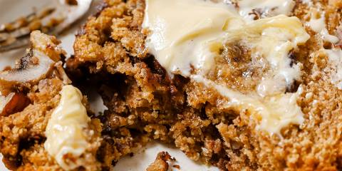 a slice of banana bread slathered with cinnamon and butter