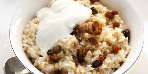 a bowl of rice porridge with nuts and fruit