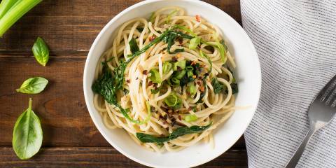 Noodles and spinach in a bowl ready to eat