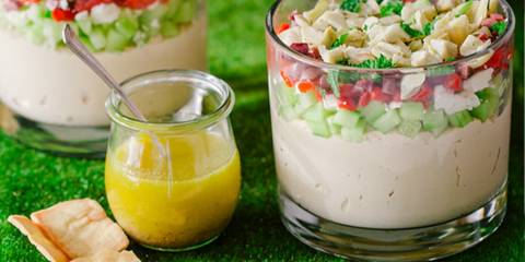 pita chips and dip along side a vinaigrette