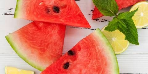 slices of watermelon and lemon with mint leaves