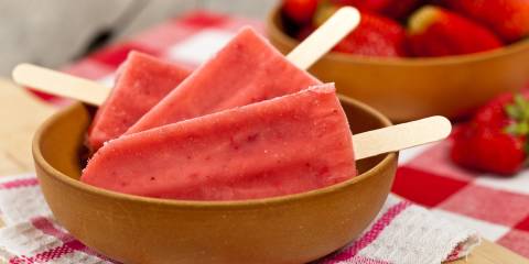 a bowl of frozen strawberry pops