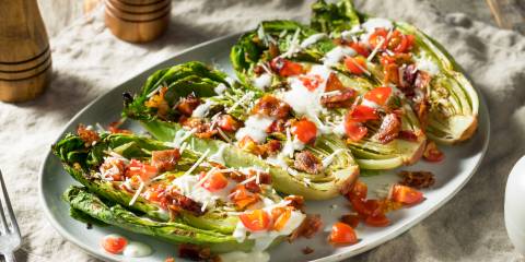 Romain lettuce with toppings on it. 