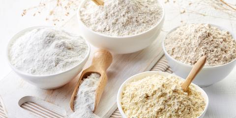 bowls of different kinds of gluten-free flour for baking