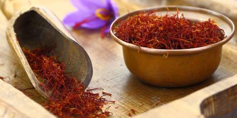 saffron threads in a bowl on a cutting board