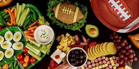 a football-themed spread of snacks and finger foods
