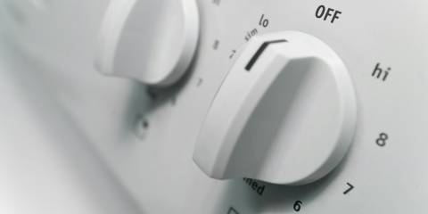 temperature knobs on a home stove-top range