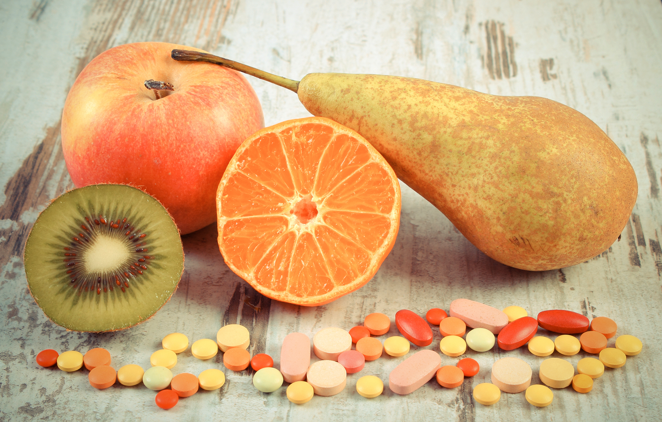 fresh fruits and vitamin tablets