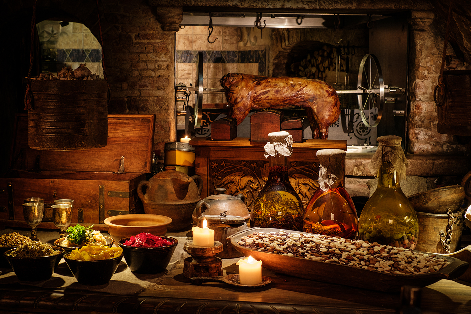 A rustic table set with a medieval feast