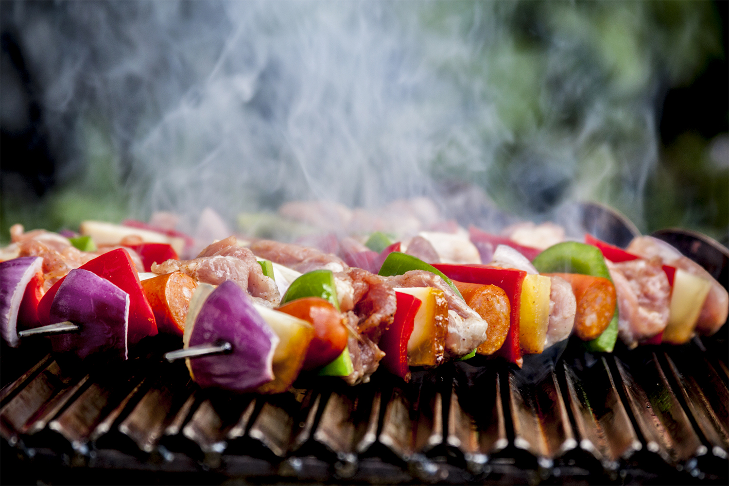 shish kebabs with vegetables, fruit, and meat, smoking and steaming